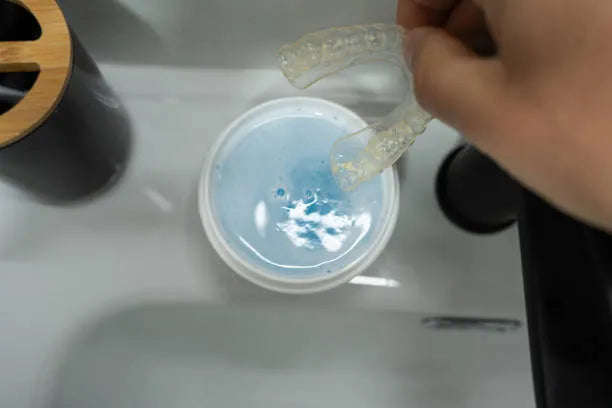 Night guard soaking for weekly deep clean